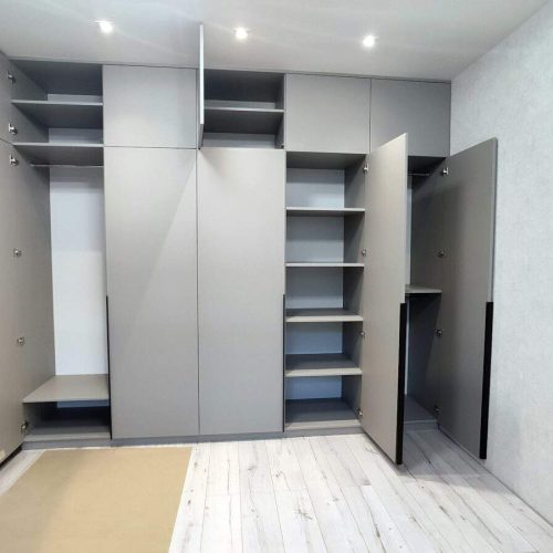 Production of cabinet furniture. Installing a wardrobe. Smart, practical and convenient storage.